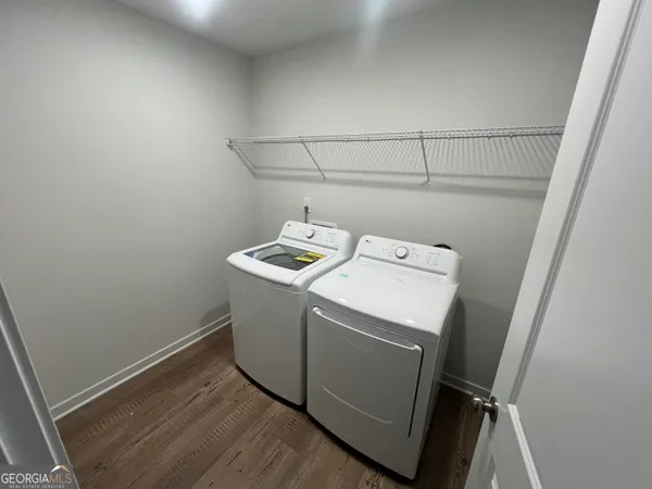a utility room with dryer and washer