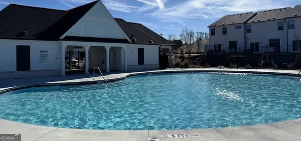 a view of backyard of house and garage