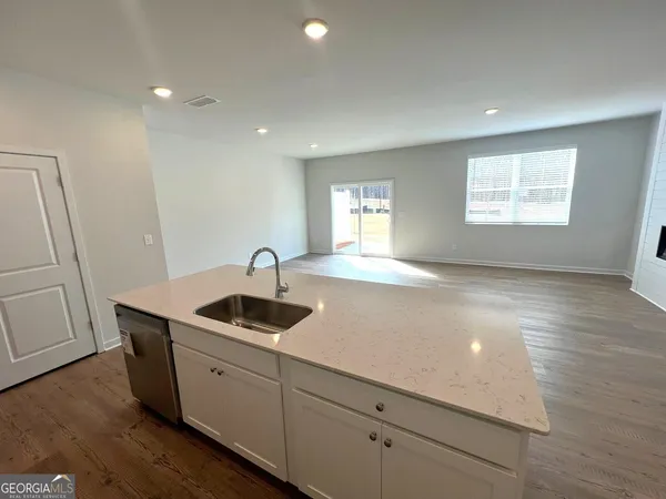a kitchen with a sink and cabinets