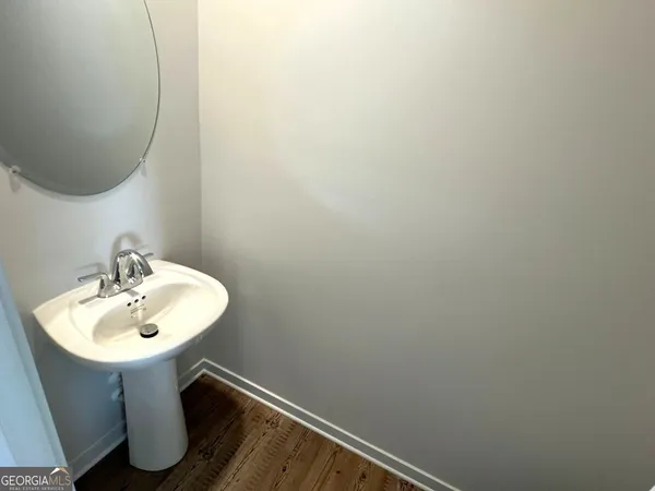 a bathroom with a sink and mirror