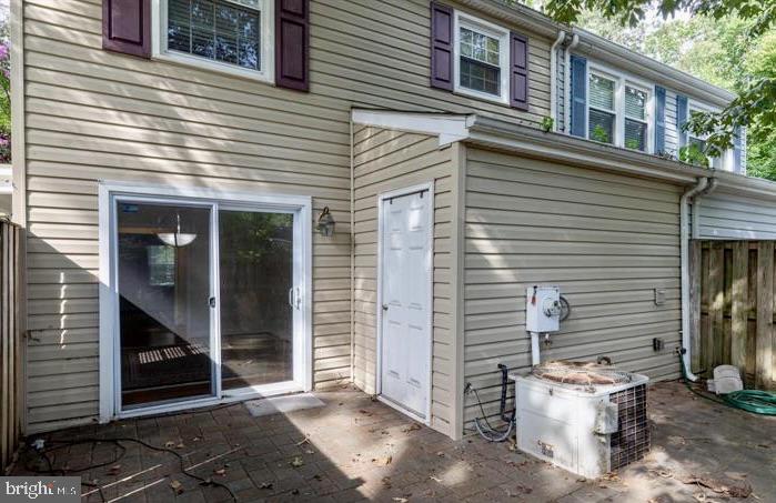 1744 Carry Place Crofton, MD 21114 - Photo 2 of 22 a view of a patio with table and chairs and potted plants