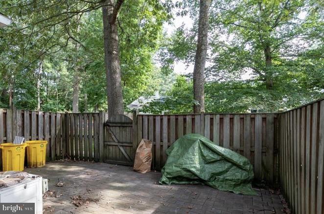 1744 Carry Place Crofton, MD 21114 - Photo 4 of 22 a view of a backyard with a small cabin and a chair