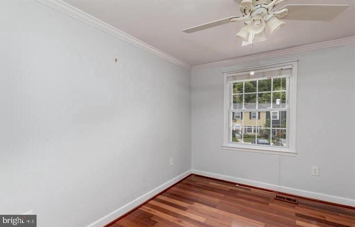 1744 Carry Place Crofton, MD 21114 - Photo 7 of 22 wooden floor in an empty room with a window