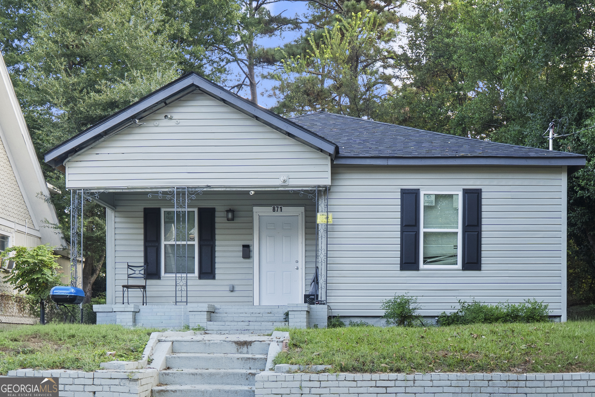 a front view of a house with garden