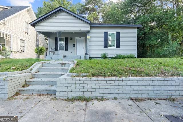 a front view of a house with a yard