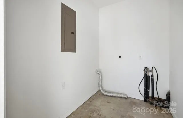 a view of a room with rack and white wall