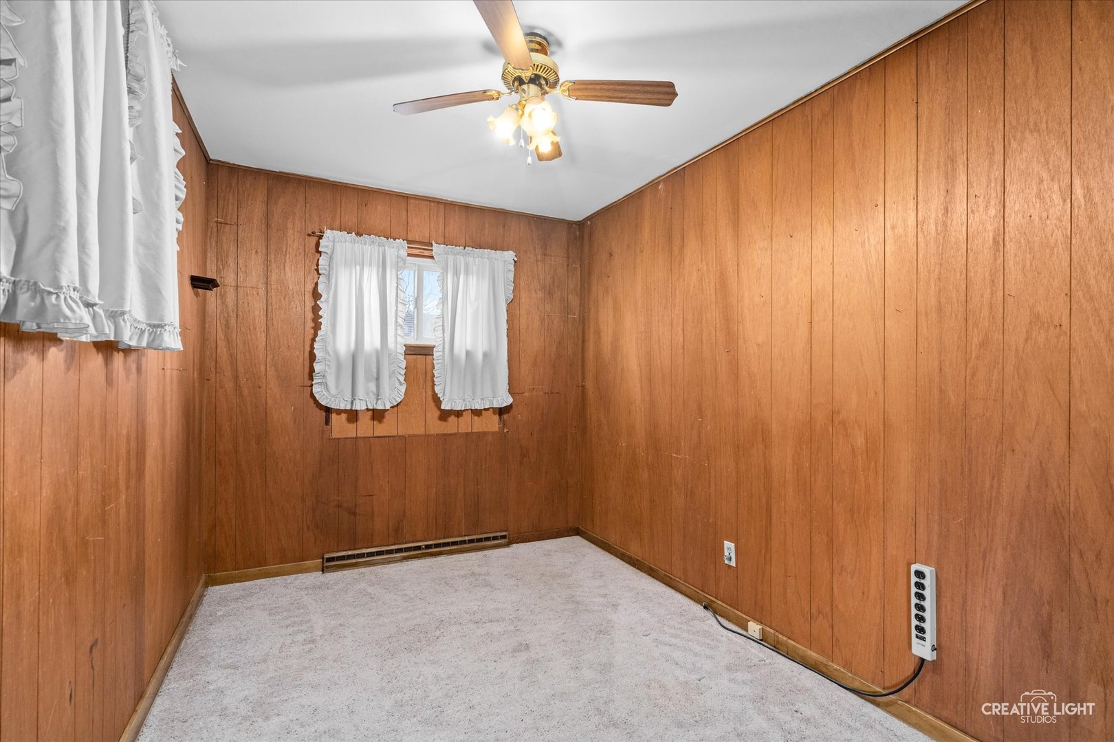 413 East Kansas Street Elburn, IL 60119 - Photo 9 of 18 a view of an empty room and a window