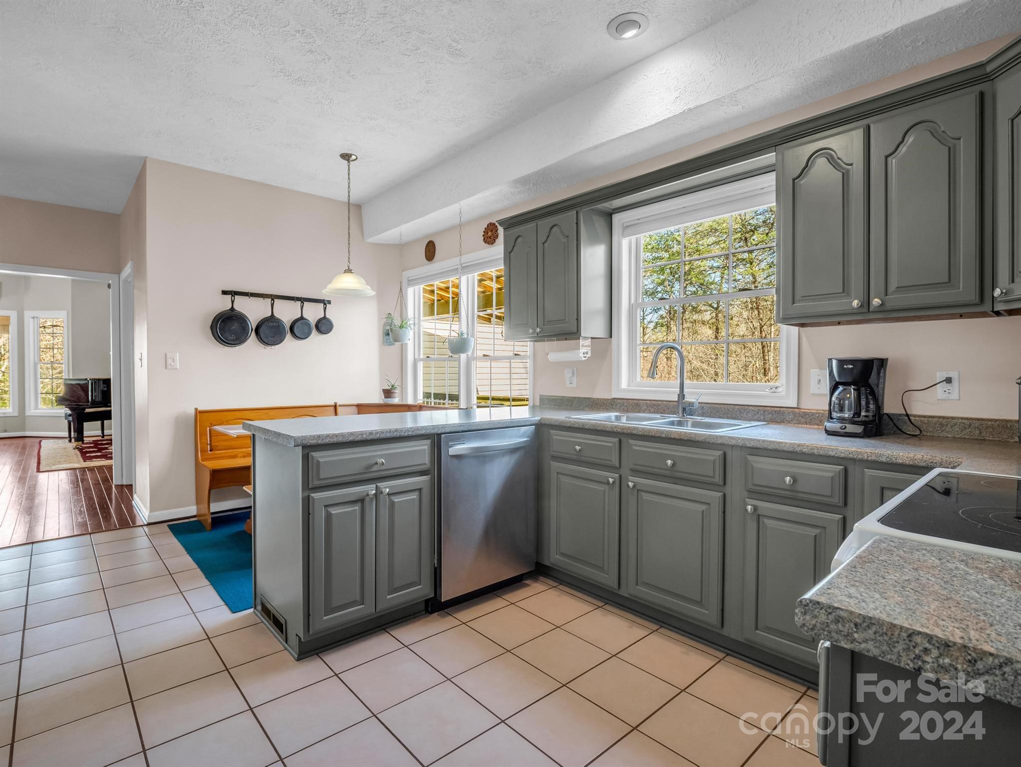 284 West T Wilkins Road Rutherfordton, NC 28139 - Photo 12 of 44 a kitchen with stainless steel appliances granite countertop a sink and cabinets