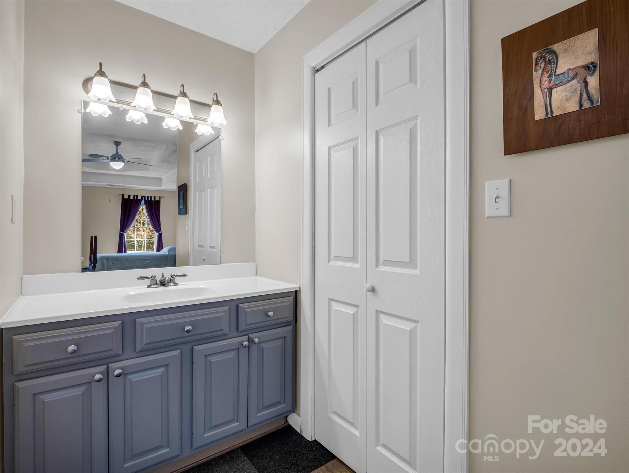 284 West T Wilkins Road Rutherfordton, NC 28139 - Photo 20 of 44 a bathroom with a double vanity sink and a mirror