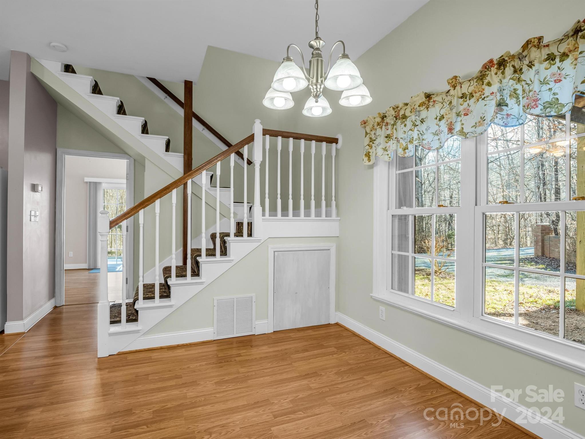 284 West T Wilkins Road Rutherfordton, NC 28139 - Photo 30 of 44 a view of a livingroom with wooden floor and stairs