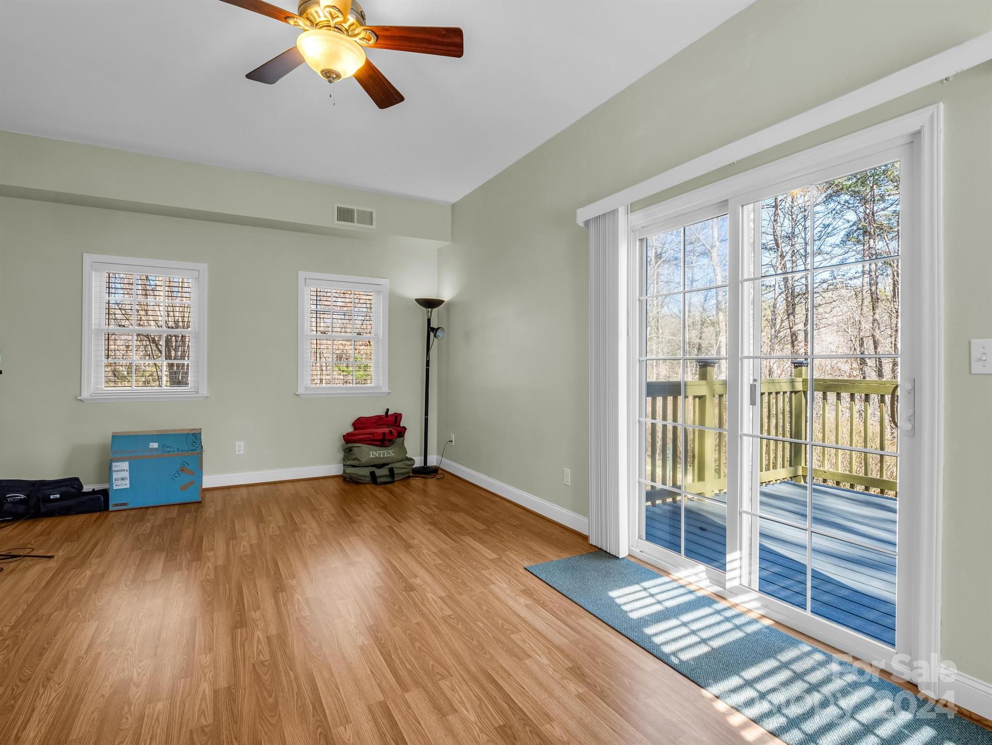 284 West T Wilkins Road Rutherfordton, NC 28139 - Photo 33 of 44 a view of an empty room with wooden floor and a window