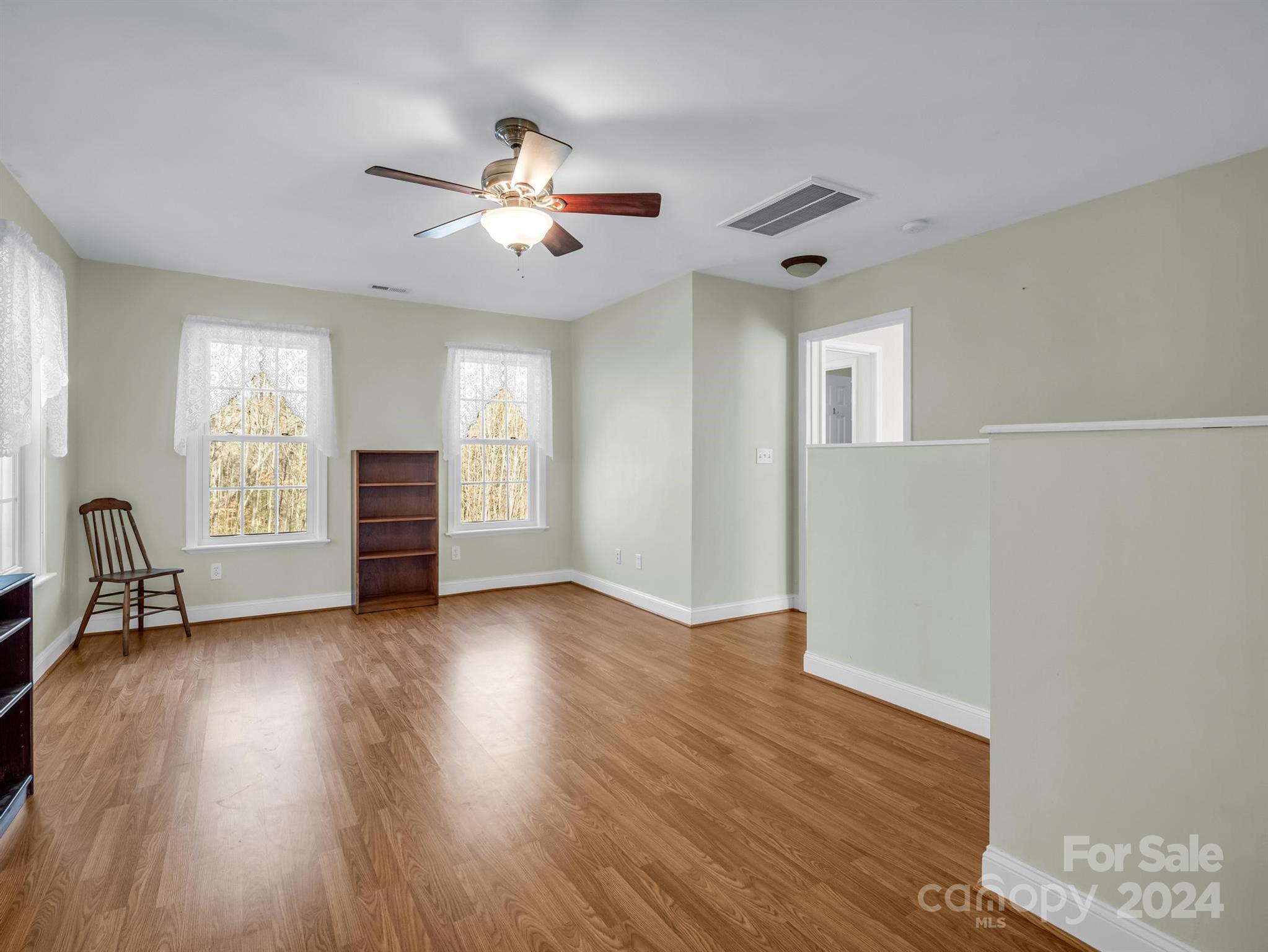 284 West T Wilkins Road Rutherfordton, NC 28139 - Photo 36 of 44 a view of an empty room with a window and wooden floor