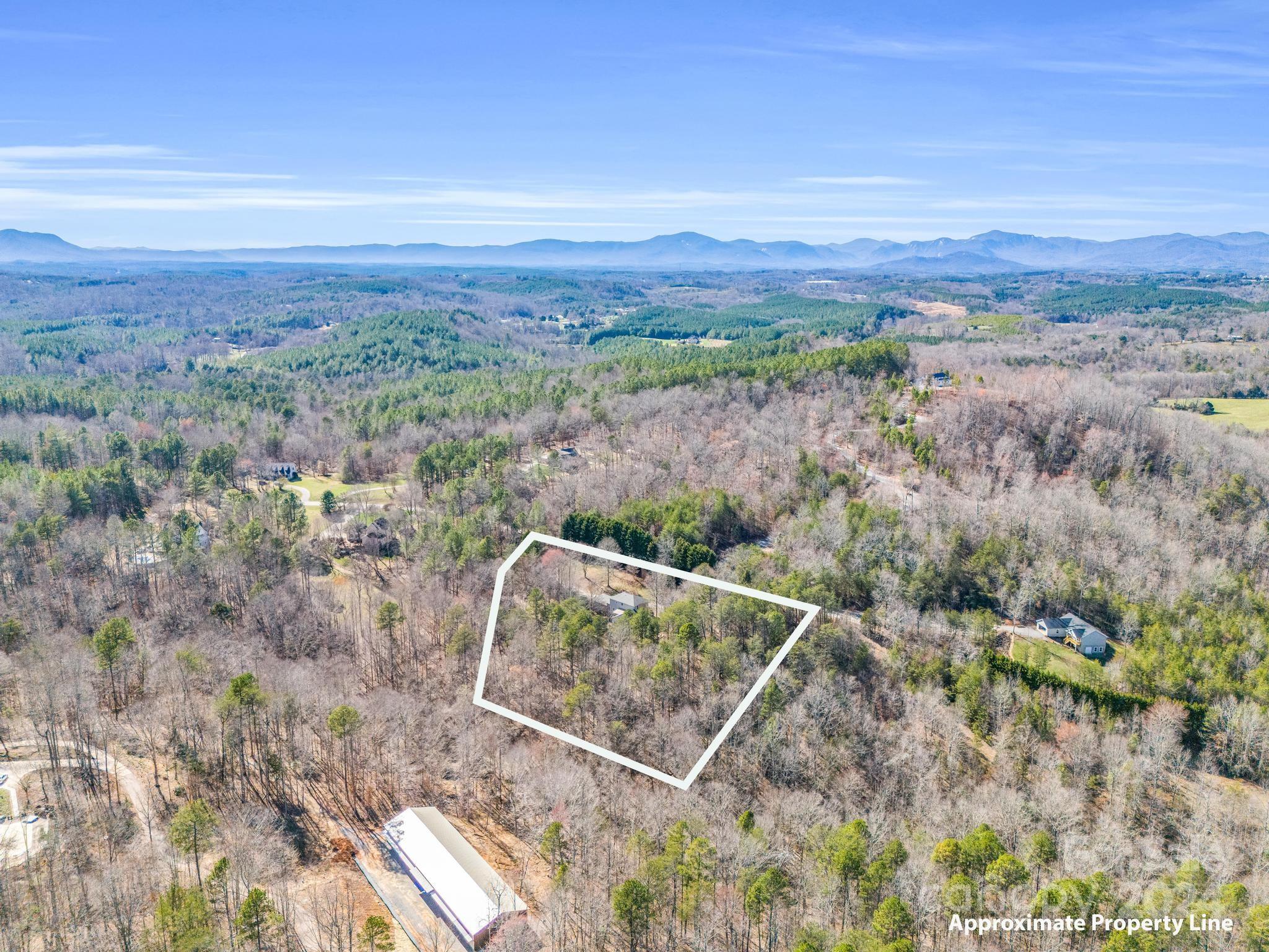 284 West T Wilkins Road Rutherfordton, NC 28139 - Photo 40 of 44 a view of a dry yard with mountain