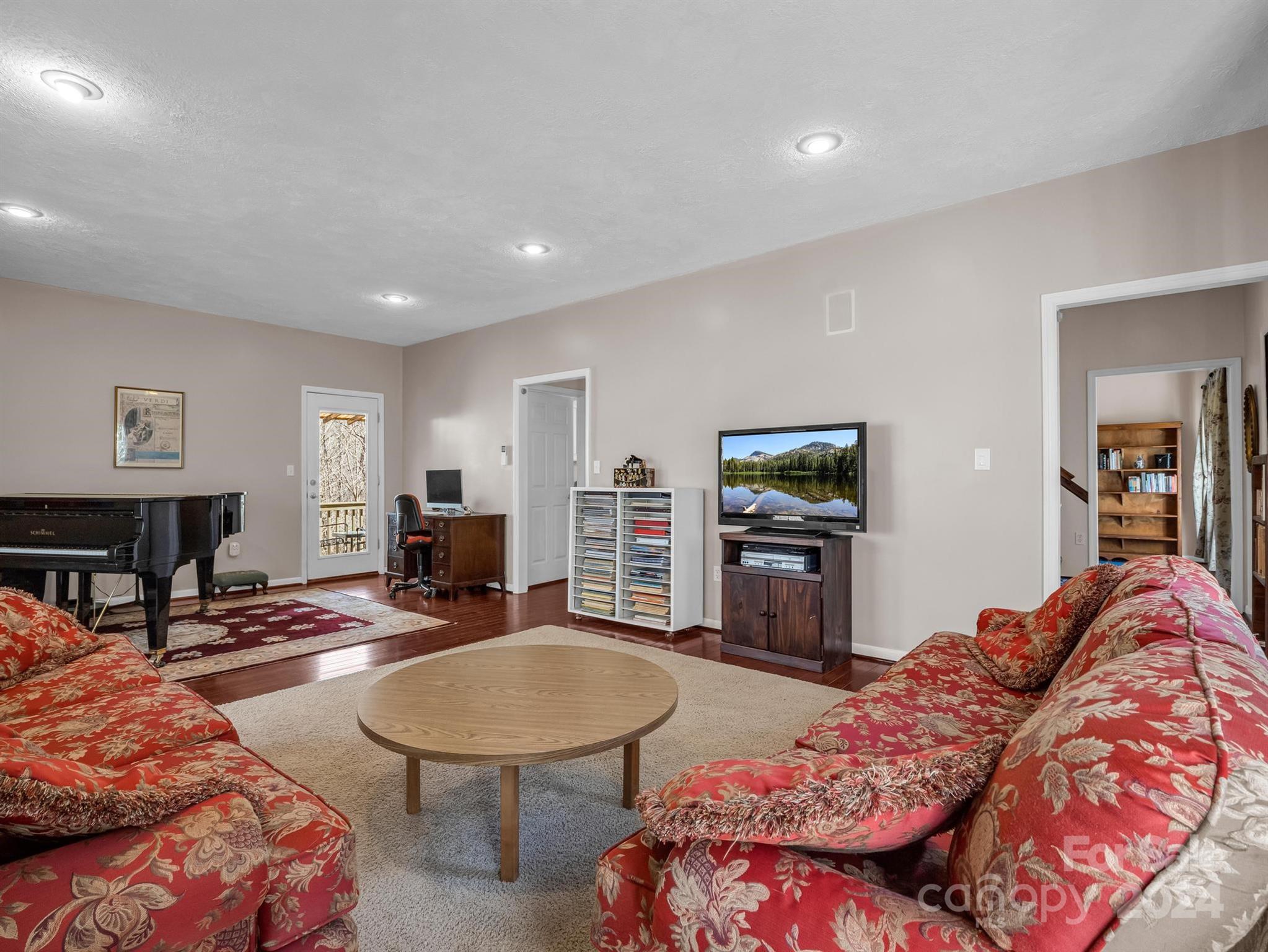 284 West T Wilkins Road Rutherfordton, NC 28139 - Photo 6 of 44 a living room with furniture and a flat screen tv