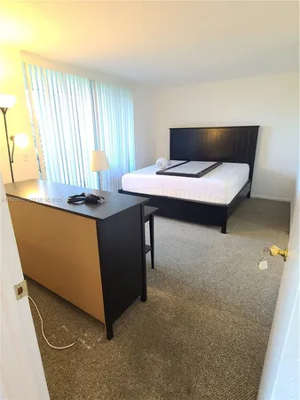 a room with a bed and a window