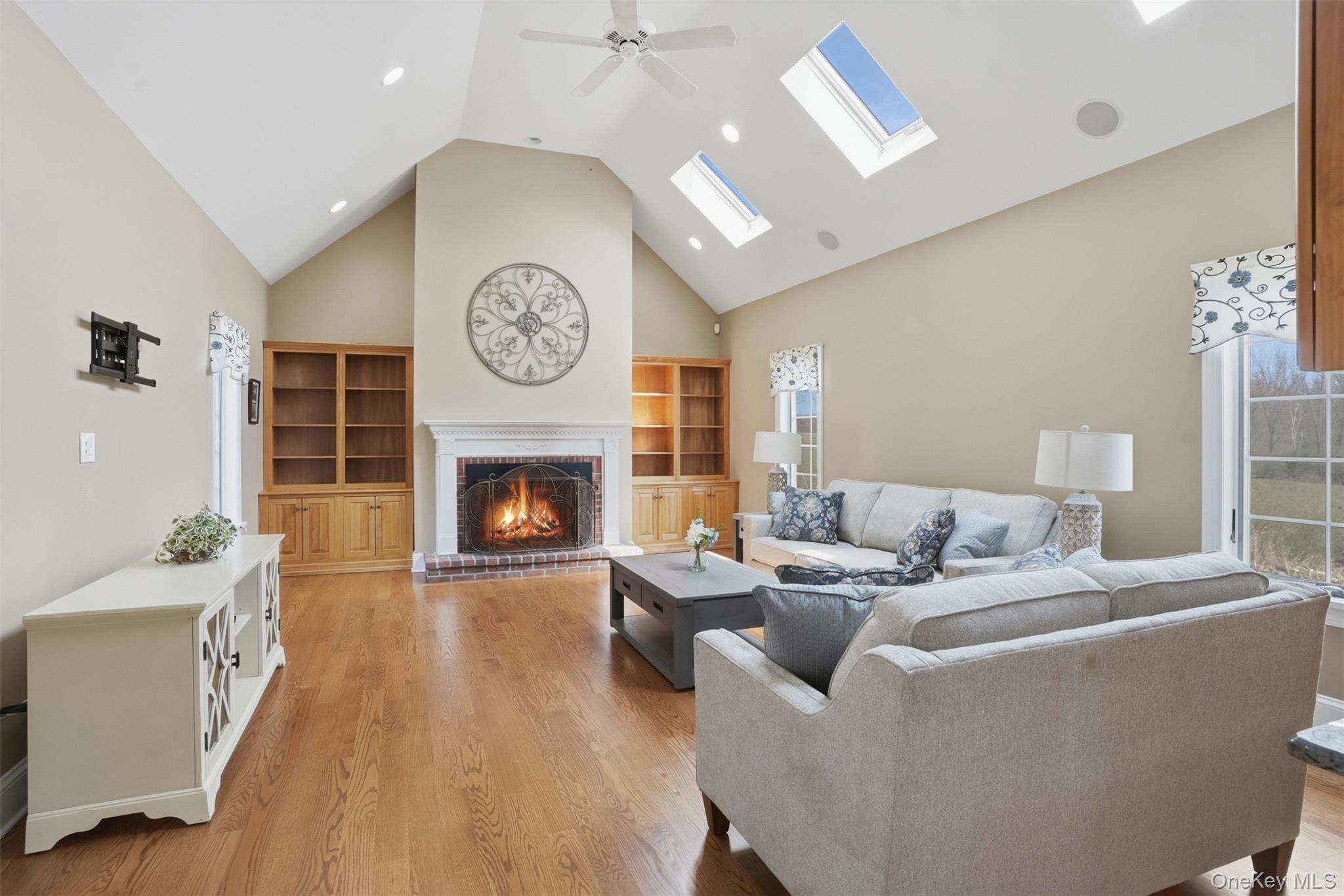 17 Forrest Way Poughkeepsie, NY 12603 - Photo 14 of 50 a living room with furniture a clock and a fireplace