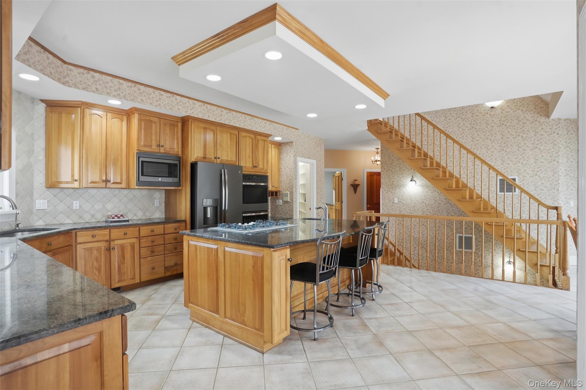 17 Forrest Way Poughkeepsie, NY 12603 - Photo 15 of 50 a kitchen with stainless steel appliances kitchen island granite countertop a sink and cabinets
