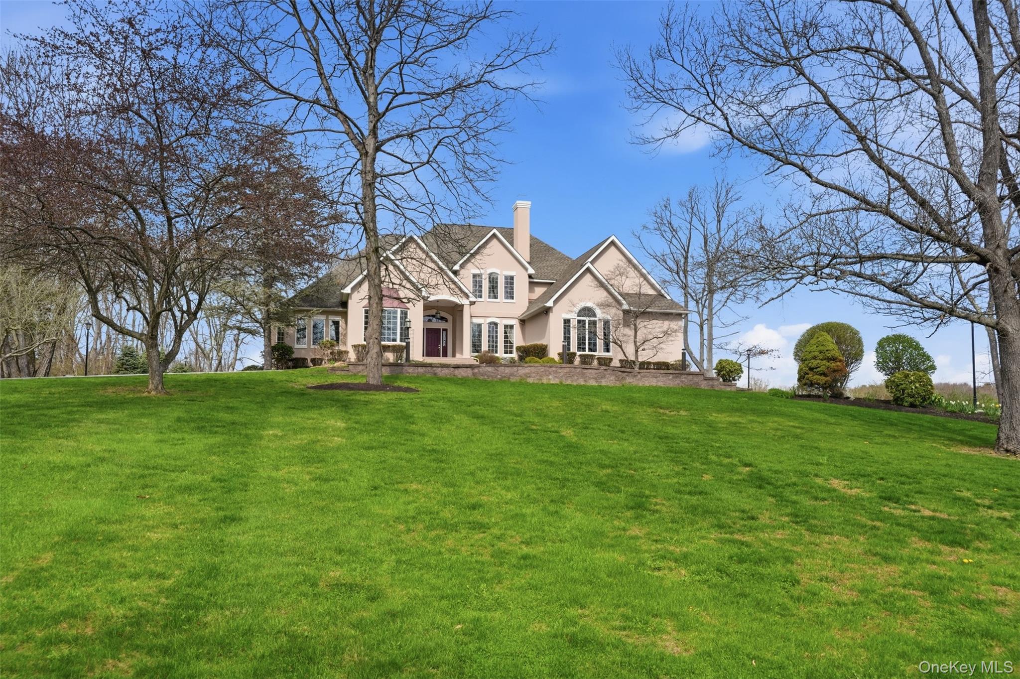 17 Forrest Way Poughkeepsie, NY 12603 - Photo 2 of 50 a view of a white house with a big yard and large trees