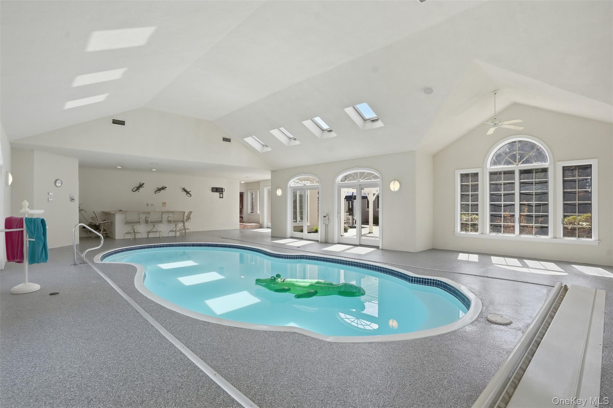 17 Forrest Way Poughkeepsie, NY 12603 - Photo 29 of 50 a large pool with a large screen and couches
