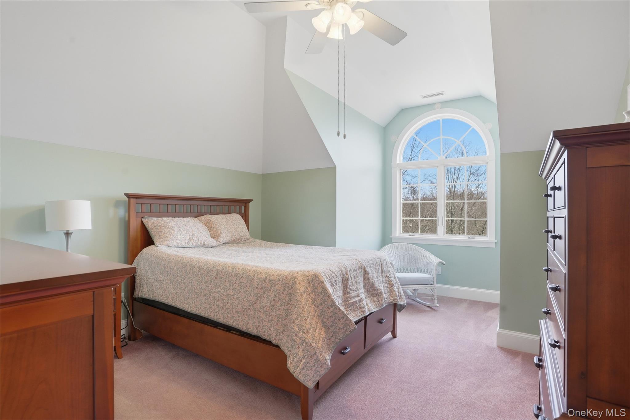 17 Forrest Way Poughkeepsie, NY 12603 - Photo 41 of 50 a bedroom with a large bed and a chandelier