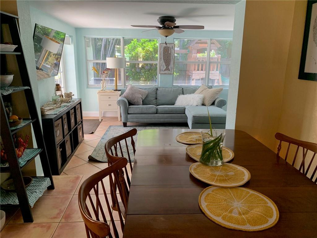 1101 Southwest 1st Avenue Pompano Beach, FL 33060 - Photo 11 of 30 a living room with furniture and a floor to ceiling window