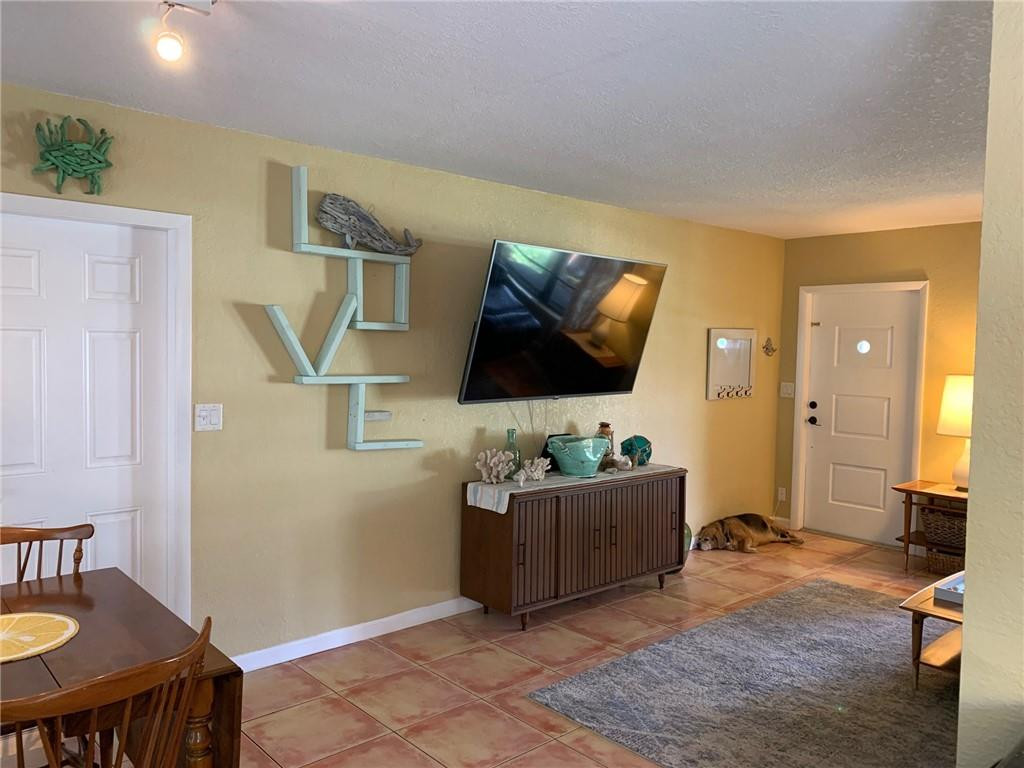 1101 Southwest 1st Avenue Pompano Beach, FL 33060 - Photo 14 of 30 a living room with furniture and a flat screen tv