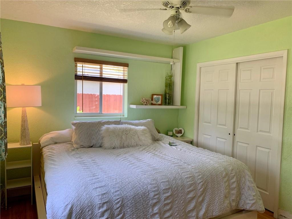 1101 Southwest 1st Avenue Pompano Beach, FL 33060 - Photo 17 of 30 a bedroom with a bed and a chandelier