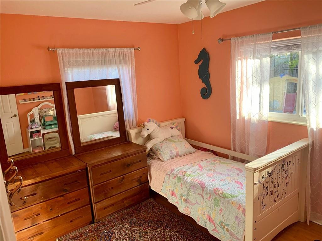 1101 Southwest 1st Avenue Pompano Beach, FL 33060 - Photo 18 of 30 a bedroom with a bed and a mirror on the dresser