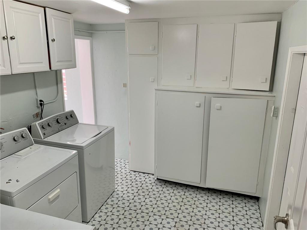 1101 Southwest 1st Avenue Pompano Beach, FL 33060 - Photo 24 of 30 a view of storage and utility room with washer and dryer