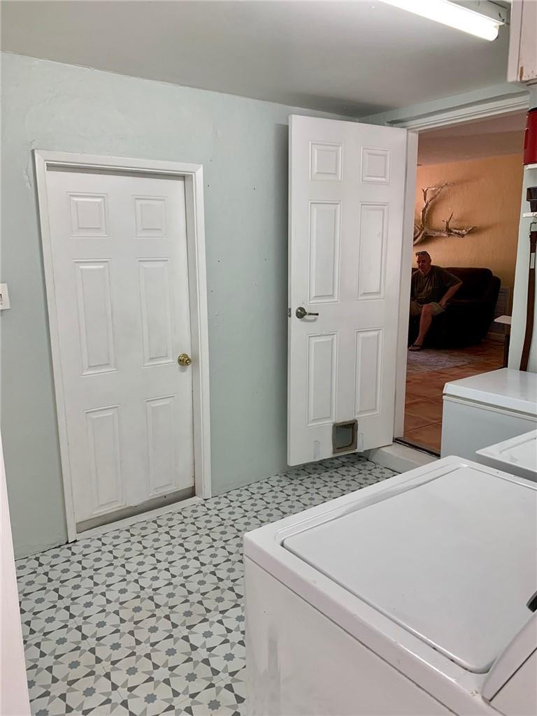1101 Southwest 1st Avenue Pompano Beach, FL 33060 - Photo 26 of 30 a bedroom with a bed and a view of bathroom