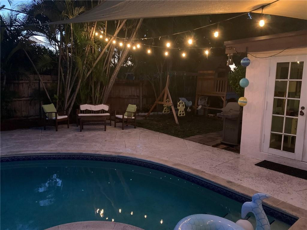 1101 Southwest 1st Avenue Pompano Beach, FL 33060 - Photo 29 of 30 a swimming pool with outdoor seating