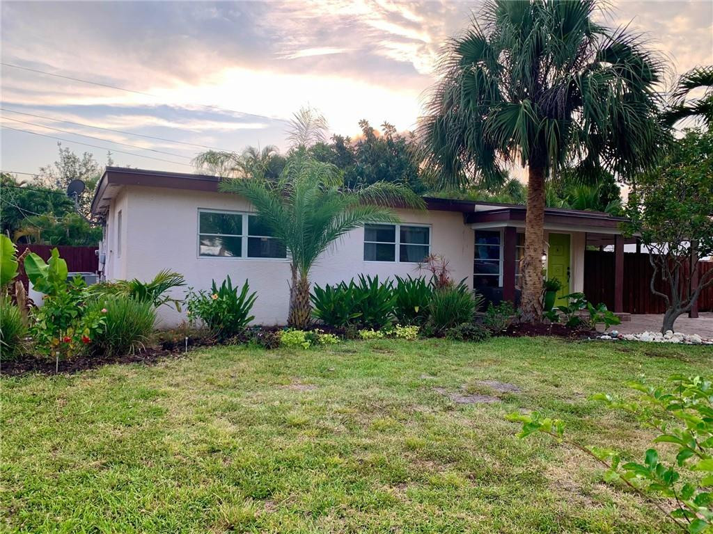 1101 Southwest 1st Avenue Pompano Beach, FL 33060 - Photo 3 of 30 a front view of house with yard and green space