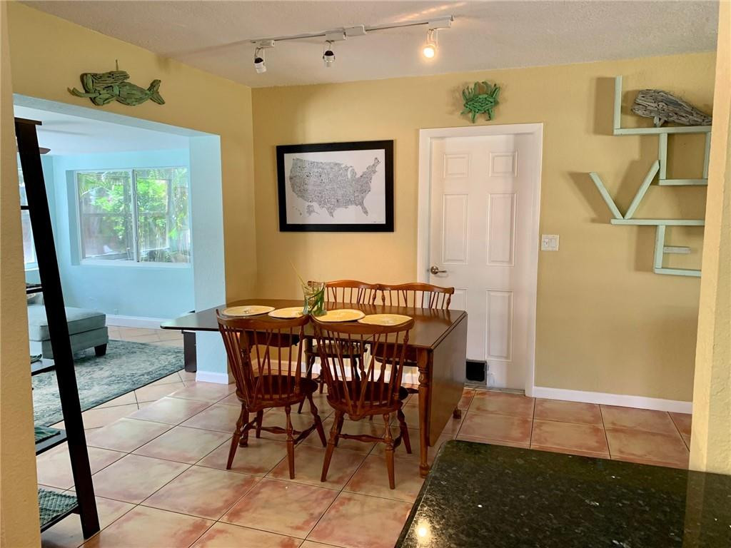 1101 Southwest 1st Avenue Pompano Beach, FL 33060 - Photo 10 of 30 a dining room with furniture and window
