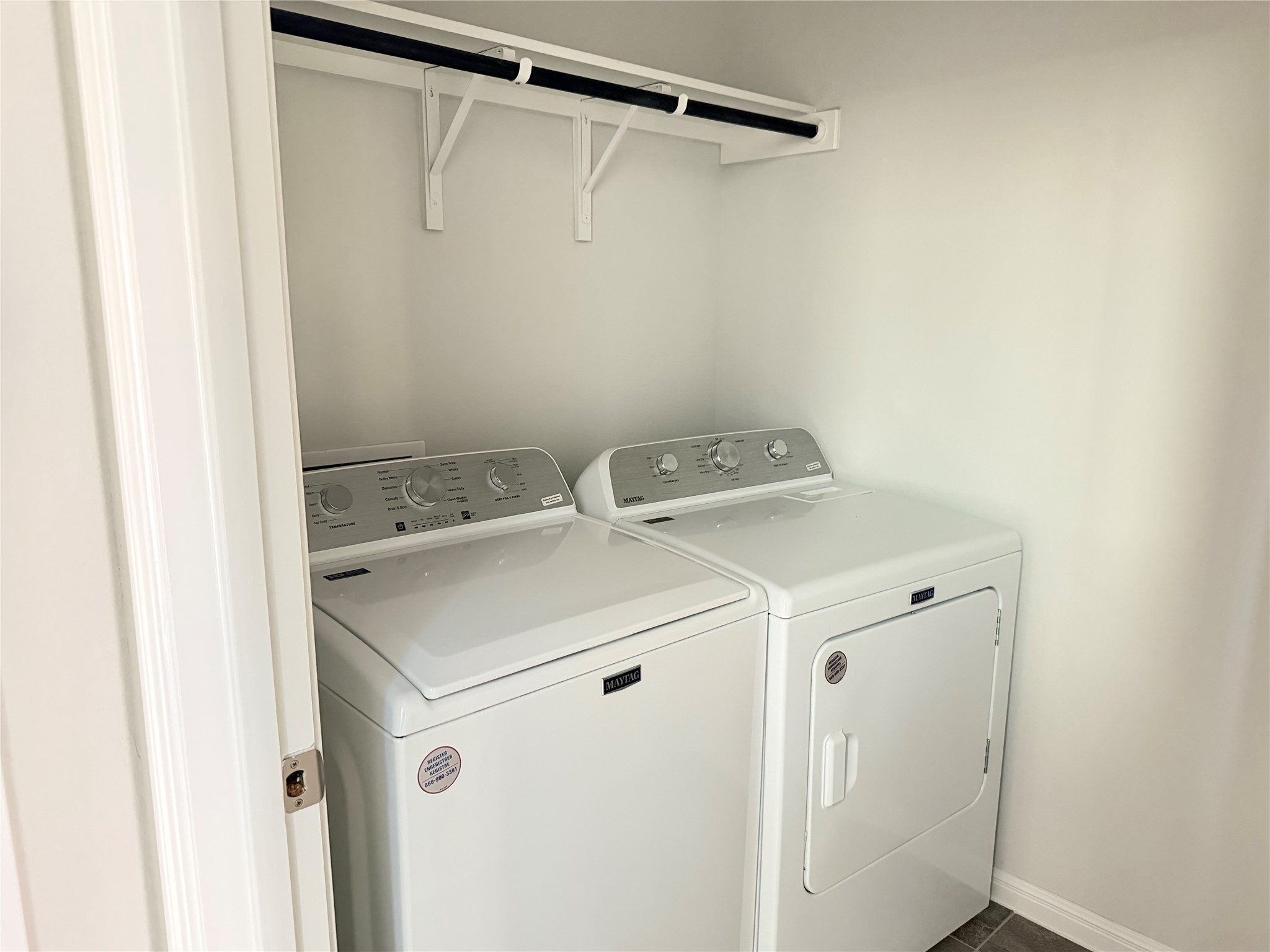 2813 Hopi Path, Unit 11 Leander, TX 78641 - Photo 6 of 17 Laundry room featuring washer and clothes dryer and baseboards