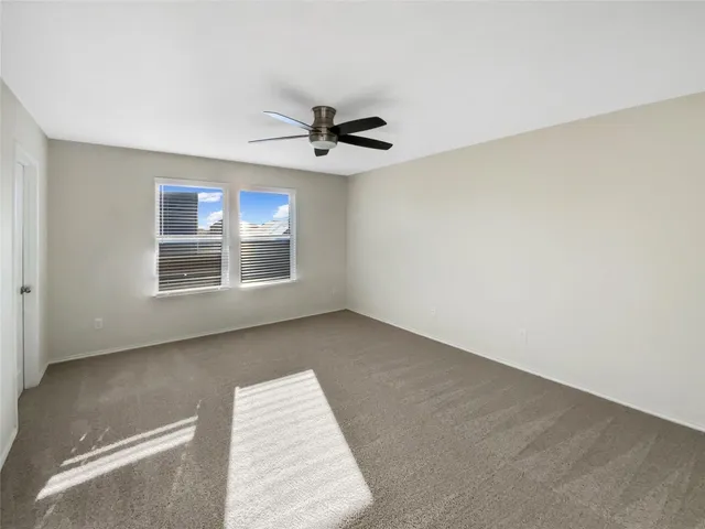 a view of an empty room with windows