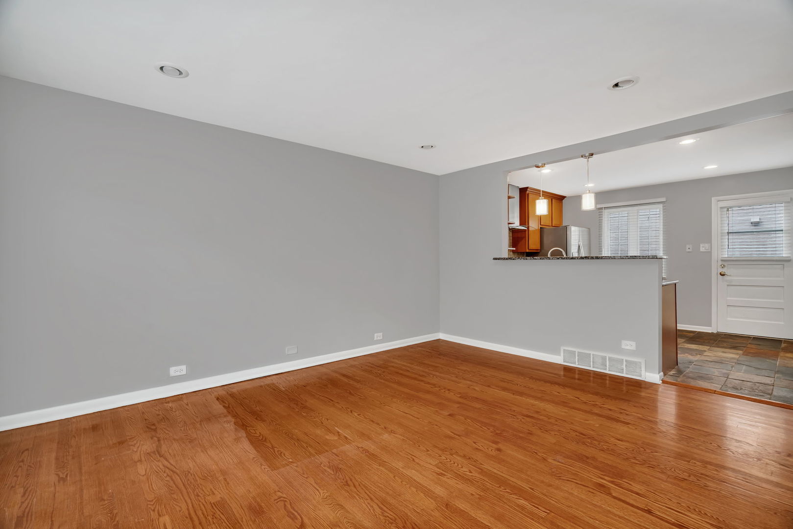 13 South Waiola Avenue, Unit 5 La Grange, IL 60525 - Photo 11 of 22 an empty room with wooden floor and windows