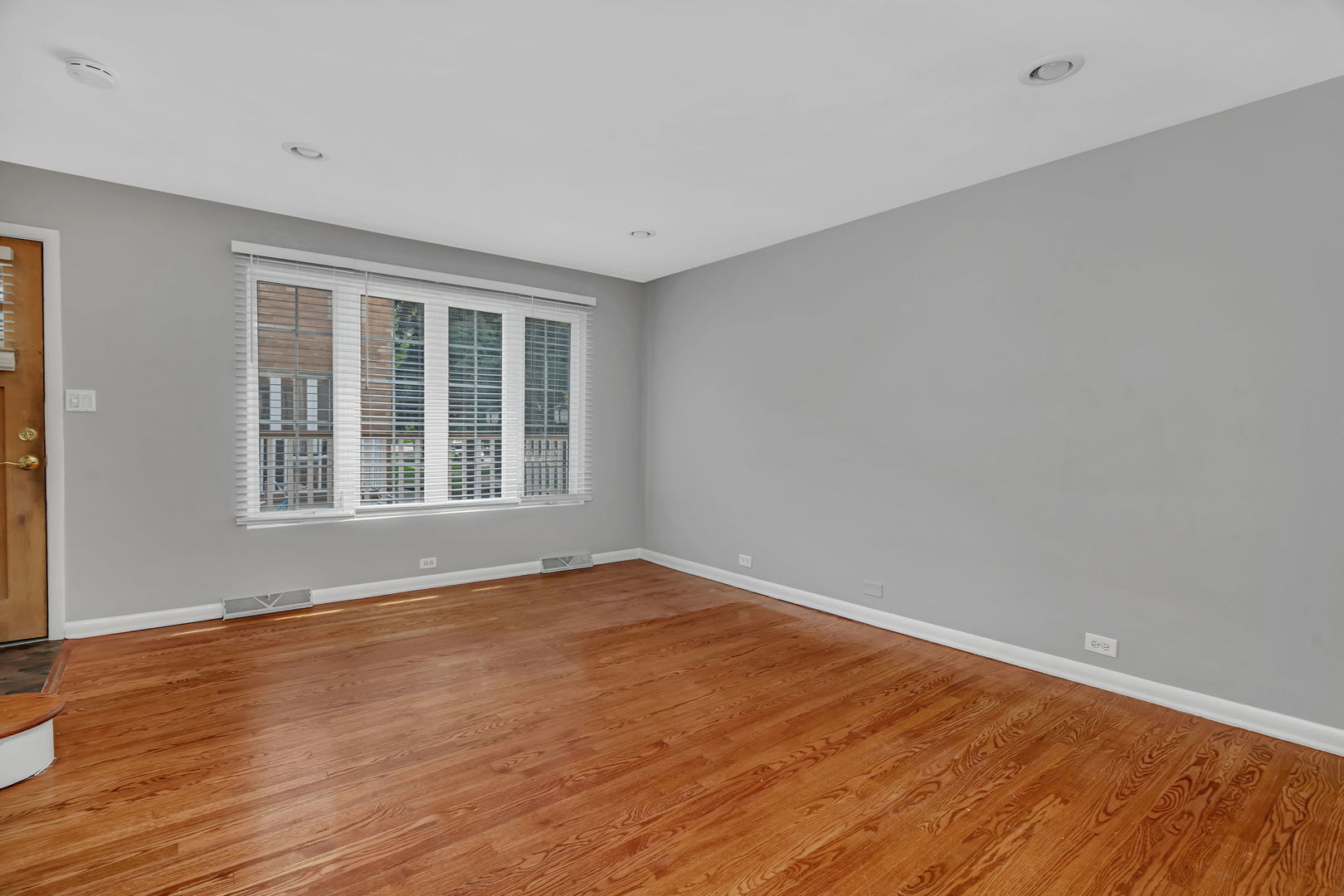 13 South Waiola Avenue, Unit 5 La Grange, IL 60525 - Photo 14 of 22 a view of an empty room with wooden floor and a window