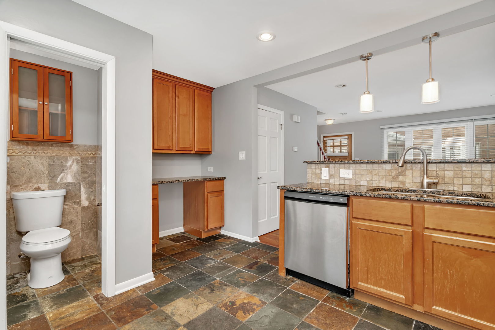 13 South Waiola Avenue, Unit 5 La Grange, IL 60525 - Photo 6 of 22 a bathroom with a granite countertop sink and a mirror