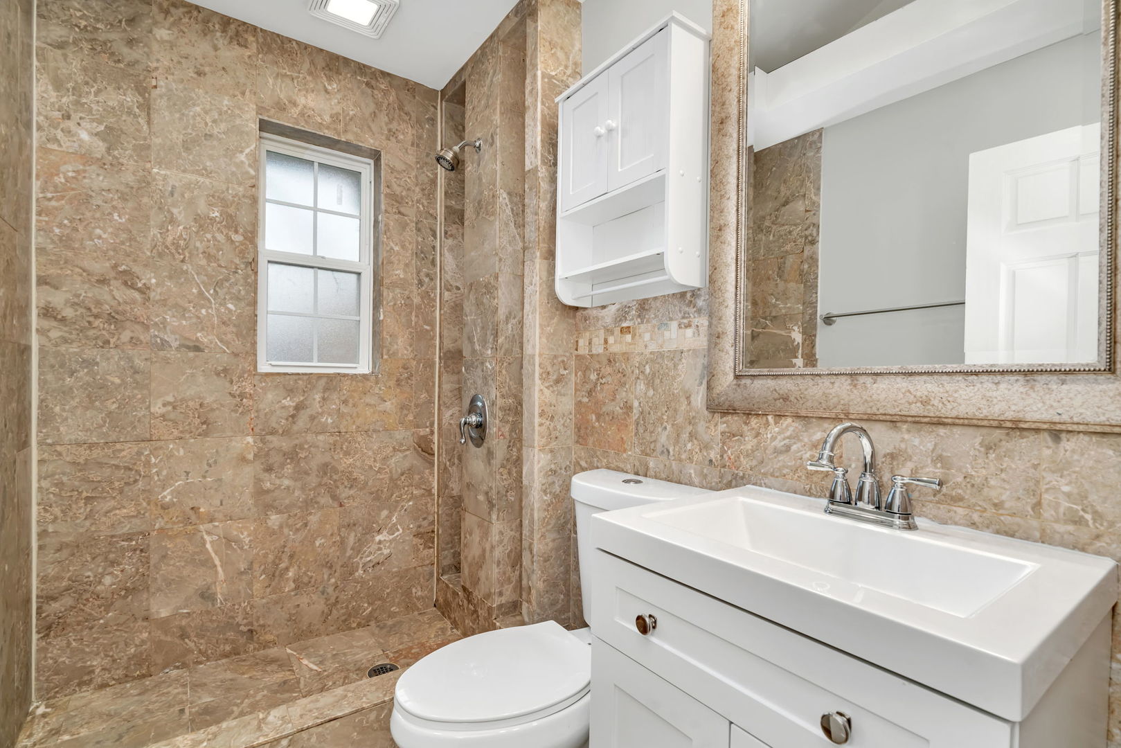 13 South Waiola Avenue, Unit 5 La Grange, IL 60525 - Photo 9 of 22 a bathroom with a sink a toilet and shower