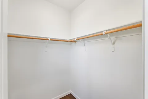 a bathroom with a double vanity sink mirror and toilet