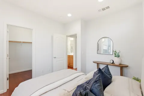 a bathroom with a sink vanity mirror and toilet