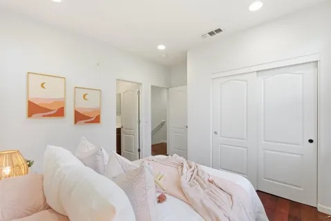 a bedroom with bed and a window