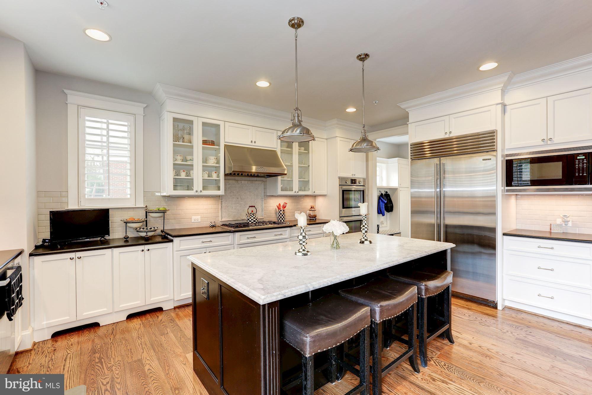 8919 Ridge Place Bethesda, MD 20817 - Photo 15 of 30 Marble island with plenty of seating