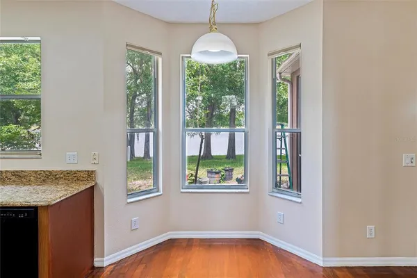 an empty room with windows and outdoor view