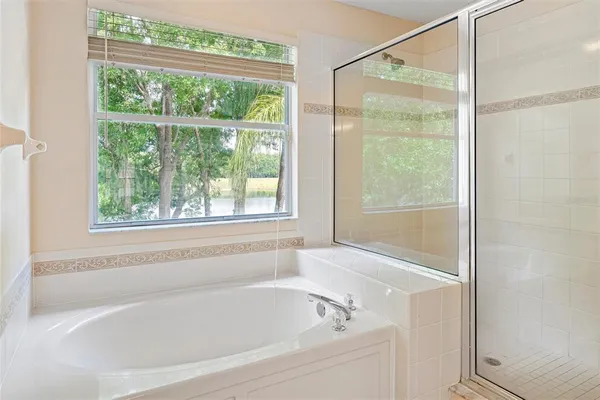 a white bath tub sitting next to a window