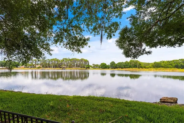 a view of a lake with houses in the back