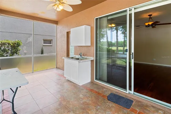 a view of a bathroom with a tub and shower