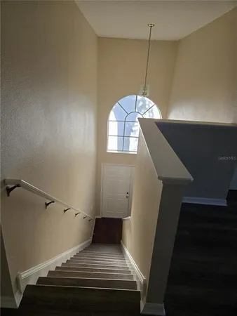 a bathroom with a granite countertop sink a toilet and shower