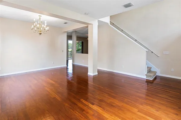 a view of an entryway with wooden floor
