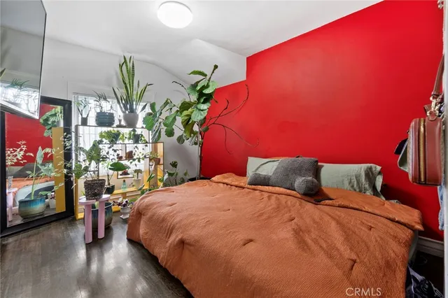 a bedroom with a bed and a couch